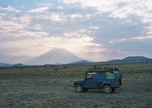 Crossing recent cooled lava flows at the foot of  the volcano Ol Doinyo Lengai in Tanzania